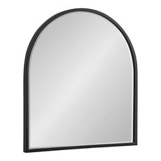 a black arched mirror on a white background