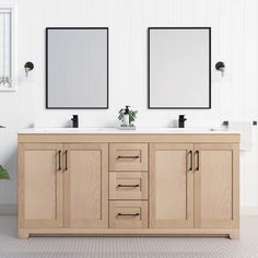 two mirrors are above the double sink vanity in this white bathroom with wood cabinetry and tile flooring