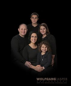 an image of a family posing for a photo in front of a black background with the words wolf gang jasper on it