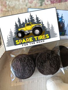 two oreos are sitting in a package with a sign that says spare tires for the road