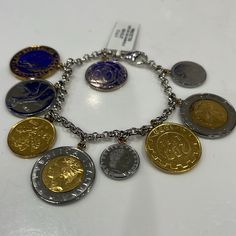 a bunch of different coins on a chain