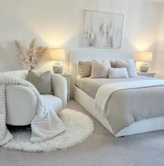 a bedroom with white furniture and carpeted flooring