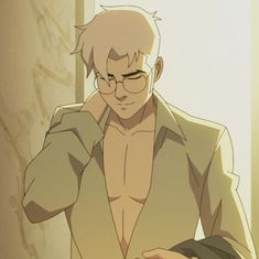 a man with glasses is looking down at his shirtless torso and has one hand on his head