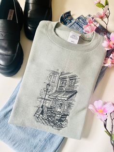 The new embroidered City Cafe design on a Hanes Eco Smart / Gildan Crewneck Cute Embroidery Designs Sweatshirts, Crewneck Design Ideas, Cafe Merch, Clothes With Quotes, Night In With Friends, City Cafe, Sweatshirt Graphic, Embroidery Tshirt, Concept Clothing