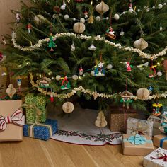 a christmas tree with presents under it