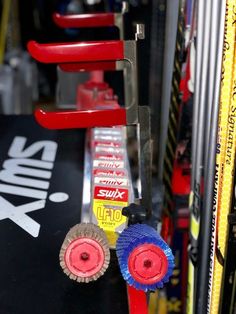 several different types of skis and snowboards on display