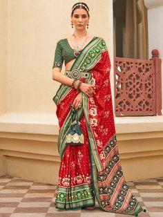 Introducing our fabulous red patola printed silk wedding wear saree with a blouse! This stunning saree is designed with a traditional look that is perfect for weddings, festivals, and other special occasions. Made from high-quality silk material, it features a vibrant red color that is sure to make a statement wherever you go.
Whether you're attending a wedding or a festival, this saree is designed to enhance your overall look and make you stand out from the crowd. The patola printed work all ov Red Pre-draped Saree With Traditional Patterns For Navratri, Wedding Choli With Printed Border For Festivals, Wedding Choli With Printed Border, Festive Choli With Printed Border For Navratri, Festive Navratri Choli With Printed Border, Red Traditional Wear With Unstitched Blouse For Eid, Red Art Silk Pre-draped Saree, Traditional Festive Choli With Printed Border, Bollywood Style Red Pre-draped Saree With Printed Border