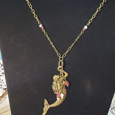 This Mermaid Is So Lovely! She Is Adorned With Pink Swarovski Crystals In Her Flowing Hair & Tail. She Has Also Found Some Matching Lovely Ocean Gems! This Pink With The Antique Gold Is Very Dramatic Stands Out Just The Right Way. Black Lace Necklace, Hair Tail, Crystal Ball Necklace, Gold Mermaid, Flowing Hair, Crystal Heart Pendant, Starfish Pendant, Pink Swarovski, Lace Necklace