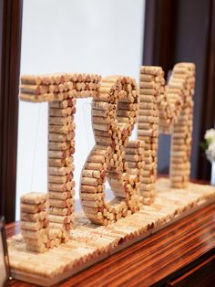 some kind of type of decoration made out of wine corks on top of a table