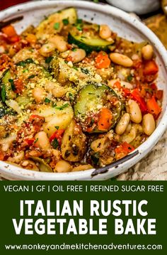 a white bowl filled with pasta and vegetables