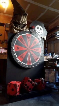 a dart board and some red dices in a room