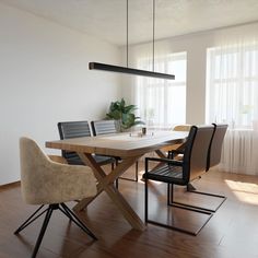 a dining room table and chairs in front of a window