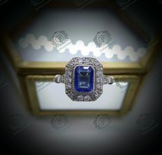 an art deco diamond and blue sapphire ring