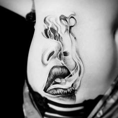 a woman's stomach with an image of a face and lips on the side