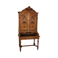 an old wooden desk with carvings on the top and bottom panel, sitting against a white background