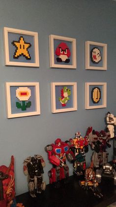 a room with pictures and toys on the wall