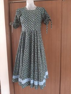 "1950s Womens Floral Cotton Home Sewn Swing Dress/Rockabilly Size S Good Vintage Condition. No Rips Or Stains. Inside The Hem Has Been Pieced Together With Some Seams But Doesn't Show From Outside. Dress Is Narrow Through The Bust And Shoulders And Wouldn't Fit On My Size M Dress Form. Facing In The Neckline Has Been Stitched By Hand. See Last Photo Cotton Floral Fabric Black Background With Blue And Green Flower Print Natural Waist Full Circle/Swing Skirt 2\" Blue Contrasting Fabric Sewn Into B Blue Cotton Dresses For Garden Party, Blue Vintage Maxi Dress For Garden Party, Vintage Blue Maxi Dress For Garden Party, Blue Retro Dress For Garden Party, Vintage Blue Midi Dress For Garden Party, Retro Blue Dress For Garden Party, Vintage Blue Midi Length Maxi Dress, Vintage Blue Maxi Dress With Short Sleeves, Black Retro Maxi Dress