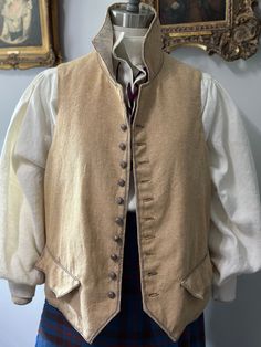 Hand stitched details are the hallmark of this OAK Outlander late 18th century gentlemen's waistcoat. It is fashioned of Buff colored Linen Cotton, hand applied pewter  trim cord and hand stitched silk thread button holes. Linen lining and linen tape ties give the vest a relaxed adjustable fit. Chest and waist measure 46 to 48". Please convo with any questions. Thank you for visiting Frocks & Foppery! Bachelorette Attire, Silk Thread, Bohemian Wedding, 18th Century, Outlander, Gentleman, Personal Style, Mens Outfits, How To Wear