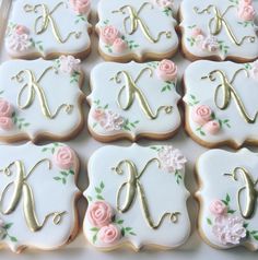 decorated cookies in the shape of letters and flowers