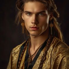 a young man with long hair and earrings on his head, wearing an ethnic outfit