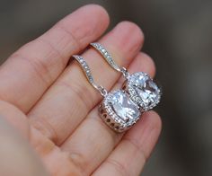 these beautiful earring made of cubic zirconia Cushion Cut drop and silver ear wire , finished bridal drop earrings are 1 .2 '' from top of the ear wire . zirconia drop are 11mm https://www.etsy.com/shop/arbjewelry Dazzling Wedding Earrings With Diamond Accents, Diamond Drop Earrings For Wedding, Drop Diamond Earrings With Sparkling Stones For Wedding, Wedding Diamond Drop Earrings With Sparkling Stones, Glamorous Wedding Earrings With Prong Setting, Wedding Drop Diamond Earrings, Hand Set Cubic Zirconia Dangle Bridal Earrings, White Gold Crystal Earrings With Diamond Accents For Wedding, Wedding Diamond Drop Earrings