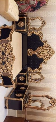 an ornately decorated room with black and gold furniture