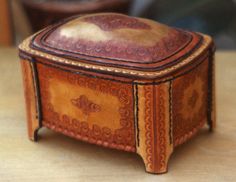 a small wooden box sitting on top of a table