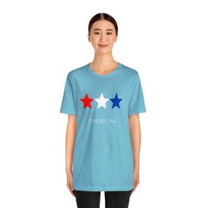 Get ready for summer. Show your Edmonds patriotic spirit with this red white and blue star design. Perfect for the beach and summer BBQs in normaltown USA - get out and Love Edmonds! This classic unisex jersey short sleeve tee fits like a well-loved favorite. Soft cotton and quality print make users fall in love with it over and over again. These t-shirts have-ribbed knit collars to bolster shaping. The shoulders have taping for better fit over time. Dual side seams hold the garment's shape for Summer Americana T-shirt With Relaxed Fit, Summer Americana Relaxed Fit T-shirt, Summer Americana Style Relaxed Fit T-shirt, Memorial Day Blue T-shirt With American Flag Print, Patriotic Short Sleeve T-shirt With Star Print, Patriotic Star Print Short Sleeve T-shirt, Red Star Print Top For Summer, Patriotic Red Star Print Top, Patriotic Blue T-shirt For Summer