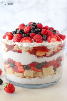 a trifle with strawberries, blueberries and raspberries in it