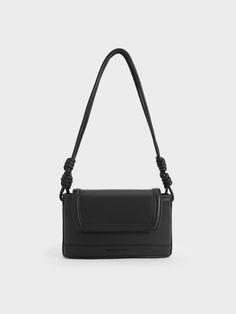 This product is made with at least 20% sustainable materials by weight. CHARLES & KEITH uses recycled, degradable, organic, and water-based materials in our eco-conscious collection.The Sabine boasts a timeless rectangular silhouette paired with a front flap magnetic closure, ensuring your belongings remain secure while easily accessible. Adding a unique touch to the Sabine is its shoulder strap, embellished with nautical-inspired knots that serve both as decorative accents and functional elemen Mint Velvet, Charles Keith, Decorative Accents, Kids Gifts, Bag Straps, Magnetic Closure, Sales Gifts, Leather Crossbody Bag, Baby Accessories