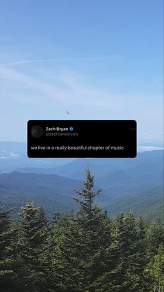 an image of the mountains with trees and sky in the background that reads, we live in a really beautiful chair of music