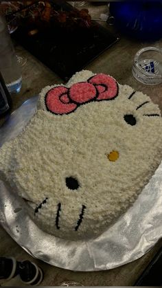 a hello kitty cake sitting on top of a table