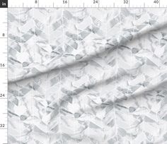 an image of a white and grey fabric with geometric shapes on it, as well as numbers