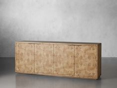 the sideboard is made out of wood and has an intricate design on it's sides