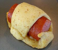 a hot dog wrapped in some kind of bread