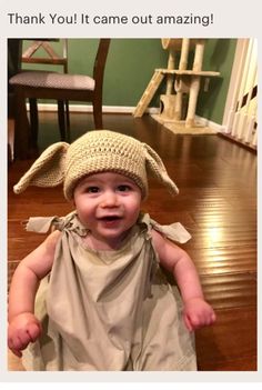 a baby wearing a crocheted hat with the words thank you it came out amazing