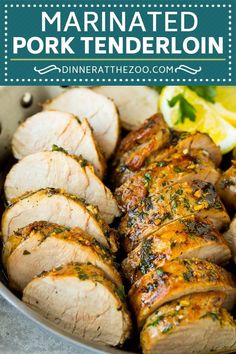 marinated pork tenderloin in a pan with lemon wedges