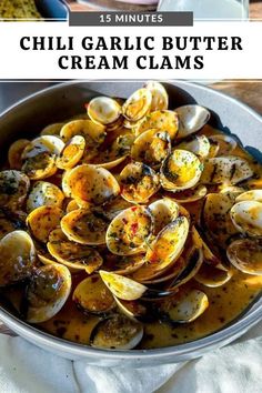 a pan filled with clams on top of a table