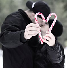 a man holding a candy cane in front of his face with the caption christmas, your way net images may be subject to copyright - send