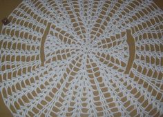 a crocheted doily is sitting on the floor