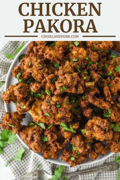 chicken pakora in a white bowl with cilantro on the side