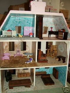 a doll house with furniture and accessories inside