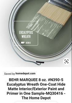 a paint can with a brush in it that says behr marquee 8