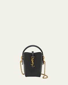 Saint Laurent "Le 37" bucket bag in calfskin leather     Top handle     Detachable chain crossbody strap, 19.2"L    Can be worn as a top handle or crossbody bag     Open top with center YSL logo strap     Golden hardware     Approx. 5.3"H x 4.3"W x 1.9"D    Made in Italy Designer Bucket Bag With Chain Strap, Modern Evening Bucket Bag With Branded Hardware, Leather Top Handle Bucket Bag With Chain Strap, Leather Bucket Bag With Chain Strap And Top Handle, Luxury Crossbody Bucket Bag With Chain Strap, Modern Evening Bucket Bag With Chain Strap, Modern Bucket Bag With Chain Strap For Evening, Modern Chain Strap Bucket Bag For Evening, Luxury Chain Strap Bucket Shoulder Bag