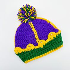 a crocheted hat with a pom - pom on the front and bottom