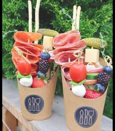 two cups filled with different types of food