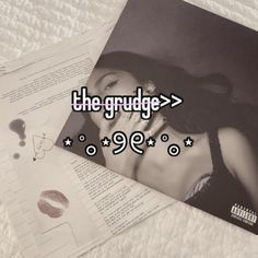 the grudges'99 album is laying on top of papers