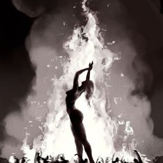 a black and white photo of a woman dancing in front of a large fireball