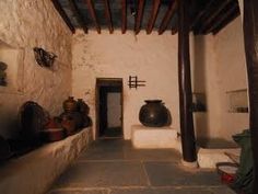 the interior of a house with stone walls