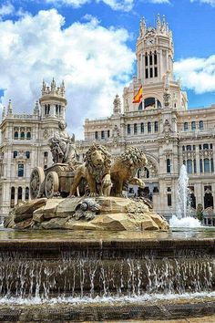 a fountain in front of a large building